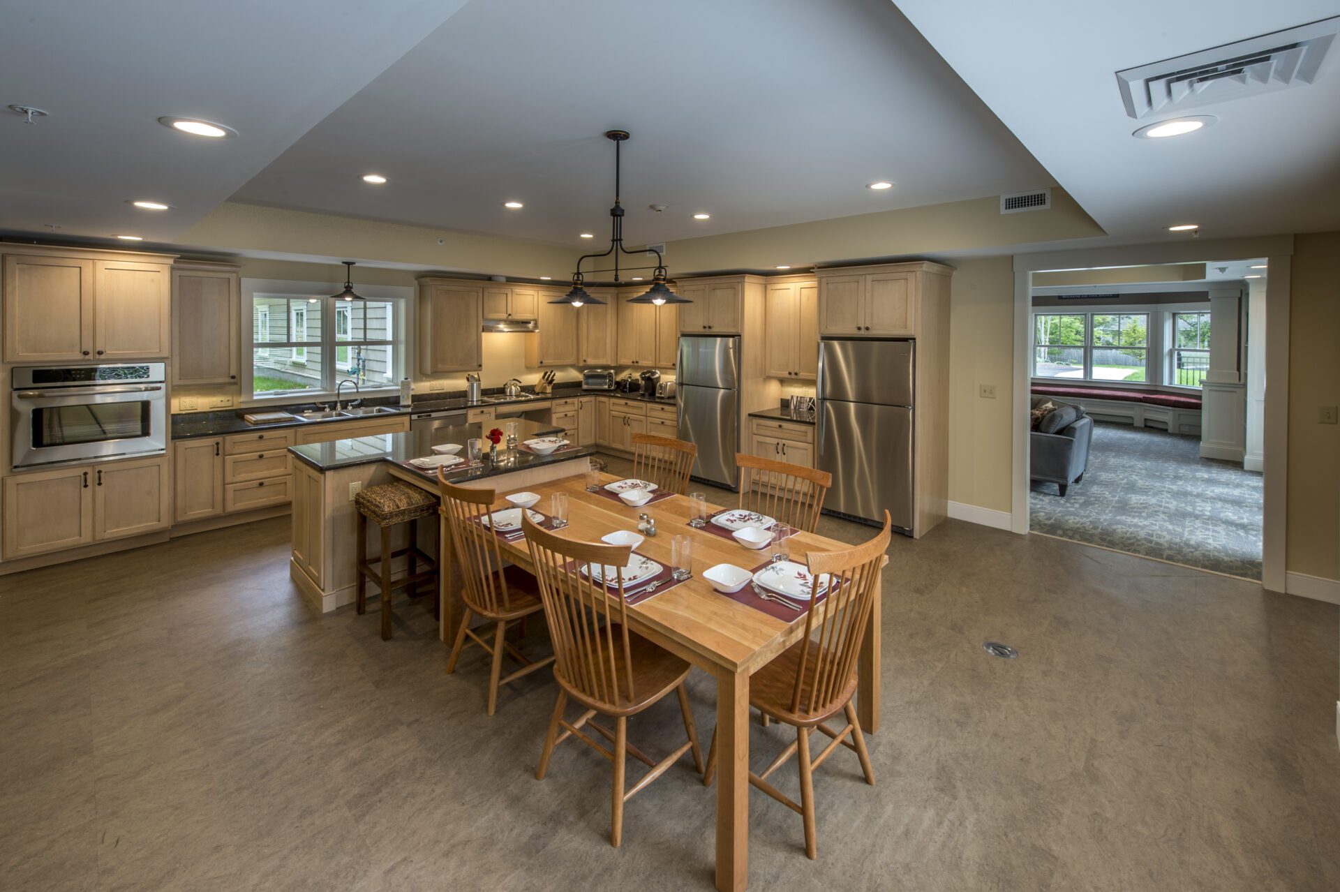 A kitchen with wooden dinning table