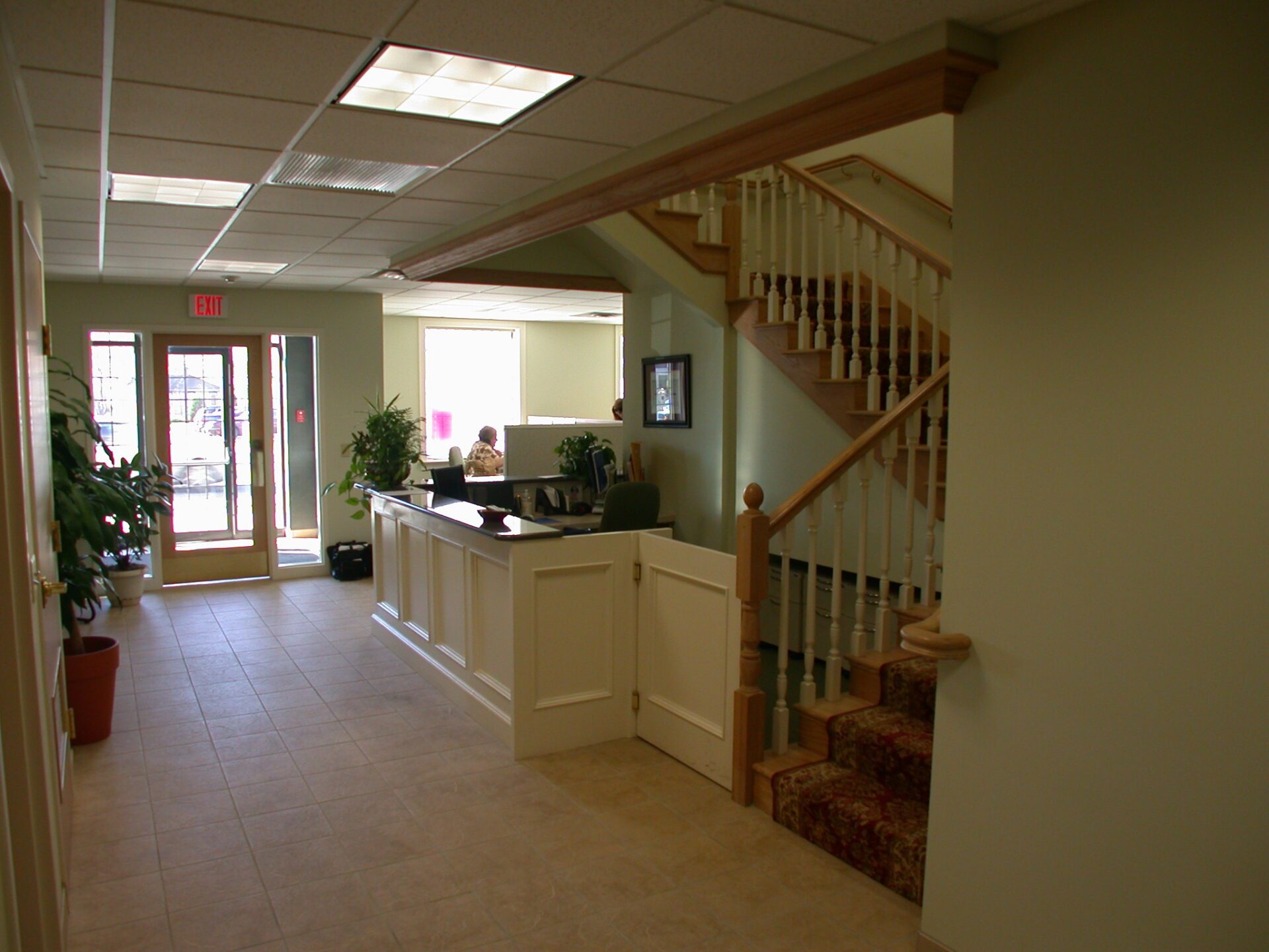 Exit door sign and staircase near reception