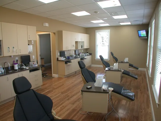 three black dental chairs