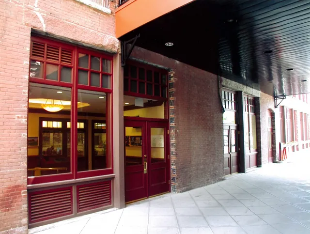 Installation of New Custom Milled, Period Mahogany and Oak Wood Storefronts Systems built to exacting historical standards.